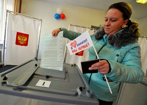 The Latest: Russian Monitors Report Election Irregularities