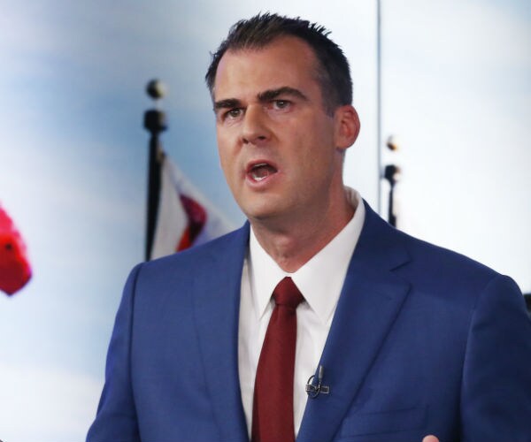 republican kevin stitt at a debate 