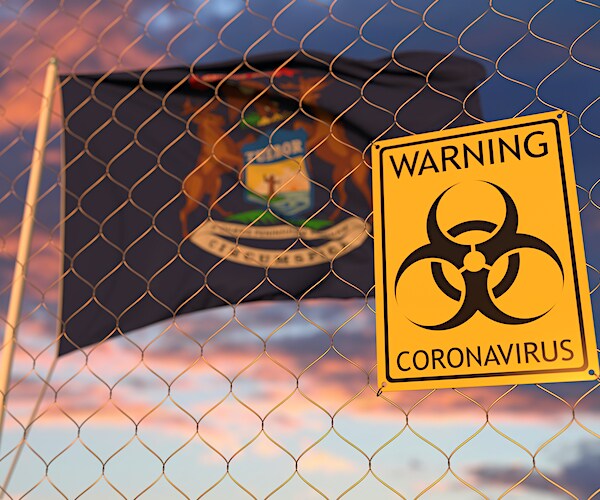 michigan flag with a coronavirus warning sign