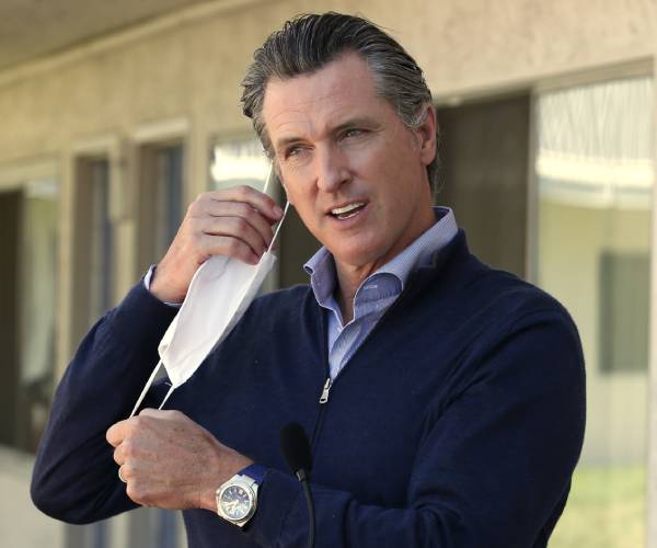 newsom removing a face mask