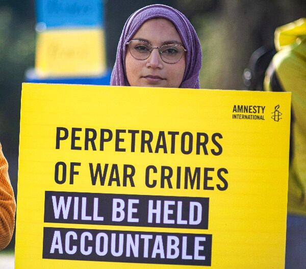 Amnesty Leader Accuses Russia of War Crimes 