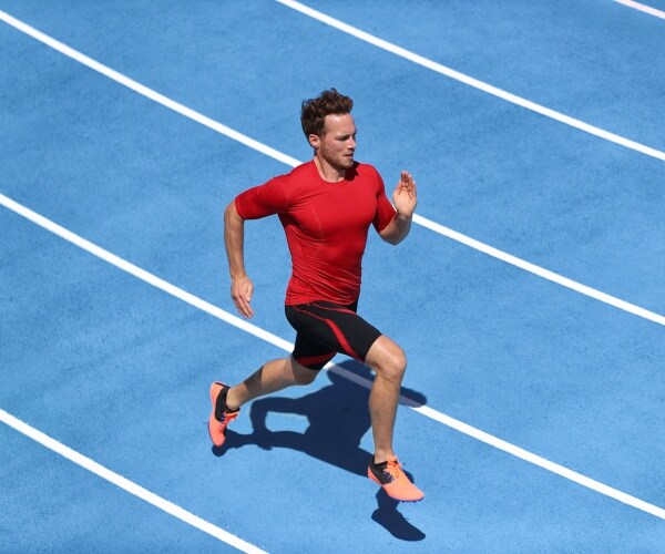 man sprinting on a track