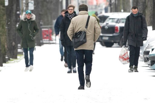 The Latest: Paris Officials Sleep outside in Frigid Weather