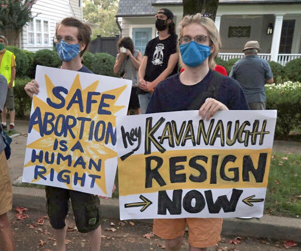 pro choice activists protest at the home of supreme court associate justice brett kavanaugh