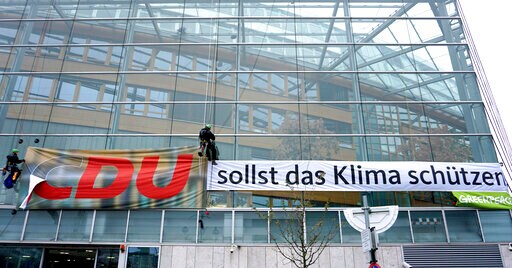 Not Very Christian: Activists Take 'C' from Merkel Party HQ