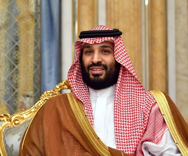 mohammed bin salman sits in chair