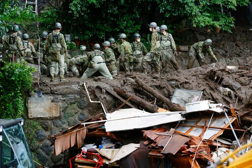 Rescuers Slog through Mud in Japan Resort Where 20 Missing
