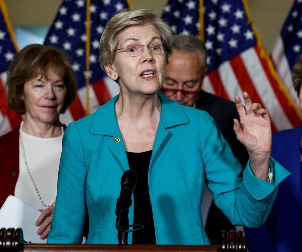 sen elizabeth warren gestures while speaking 