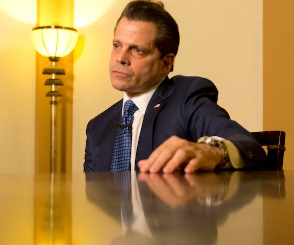anthony scaramucci sits back smugly as he speaks to the media to trash the president he used to defend