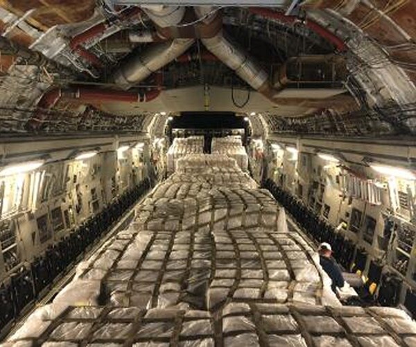 pallets are on a stripped out cargo plane