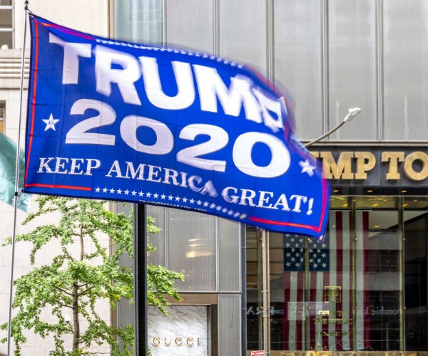 a trump campaign sign is shown outside trump tower in new york