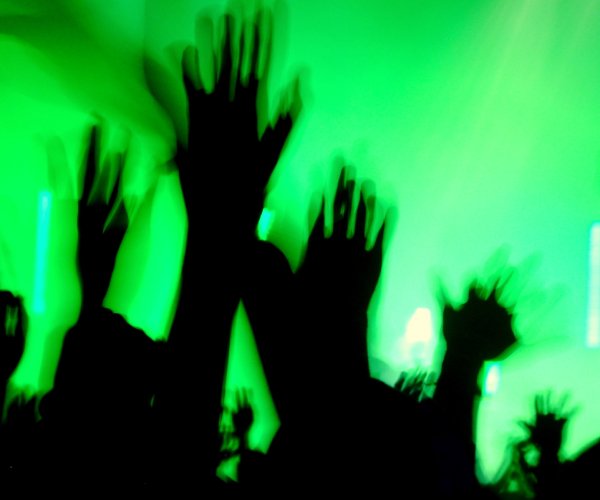 hands raised at a concert
