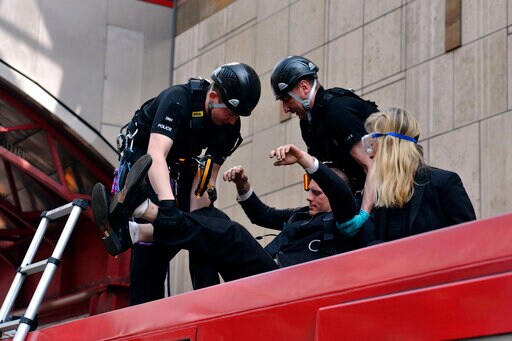 UK Climate Protesters Block Roads, Glue Themselves to Train