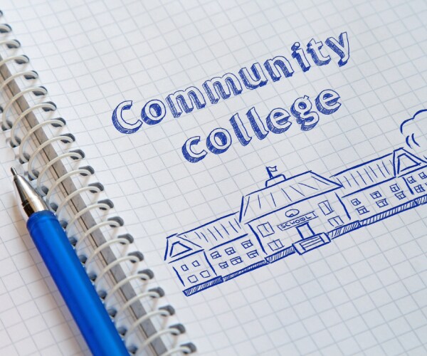 a drawing of a community college labled as such on a notebook page of graph paper