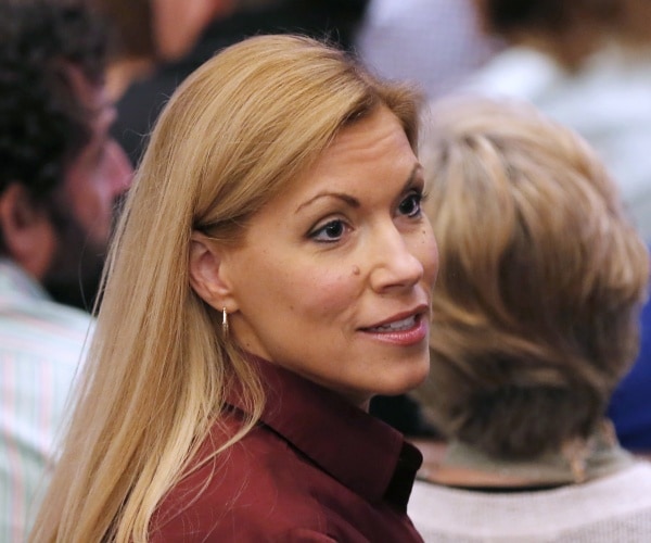 van duyne in a reddish brown jacket in a crowd of people