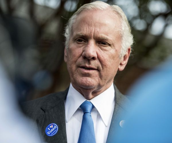 south carolina governor henry mcMaster talks with the press after casting votes at a polling station.