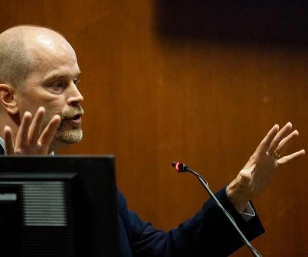 Iowa Murder Suspect Blames Mystery Men for Runner's Slaying