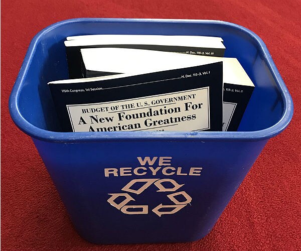 Top Finance Dem Posts Photo of Trump Budget in Recycling Bin