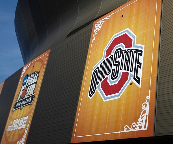 a huge logo of the ohio state buckeyes is on the side of a stadium for a basketball tournament