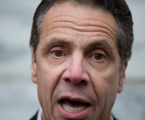 Protesters in NY Fill Casket Outside Nursing Home with Cuomo's Book Covers