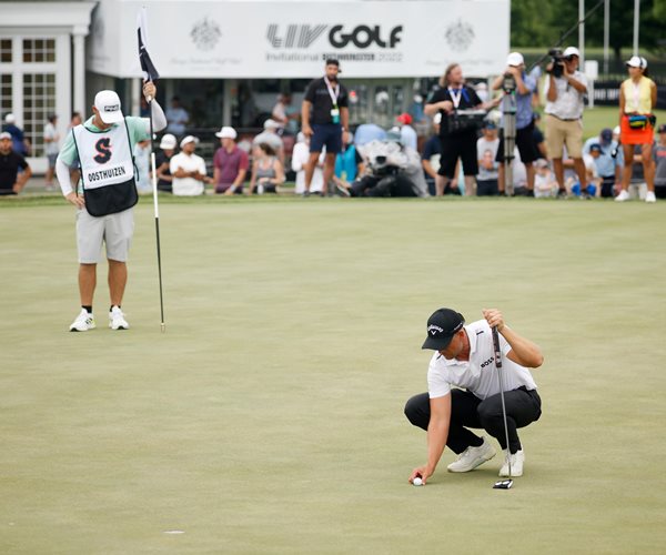 Henrik Stenson lines up a putt for birdie