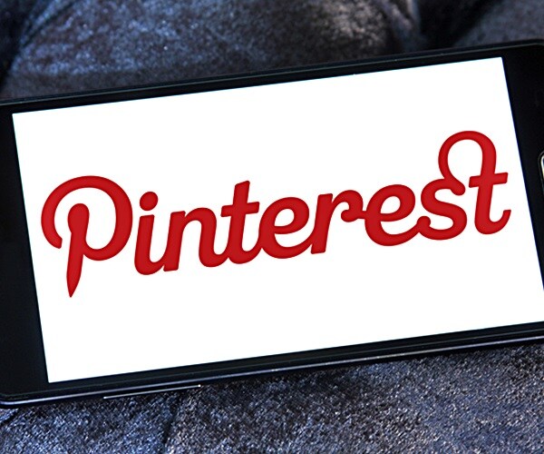 pinterest corporate logo symbol emblem on computer pad screen