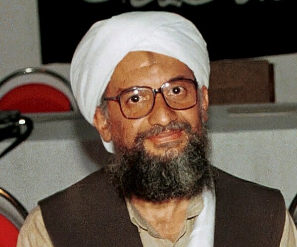 ayman al-zawahri poses for a photo