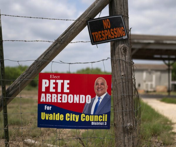 a political sign for pete arredondo is posted 