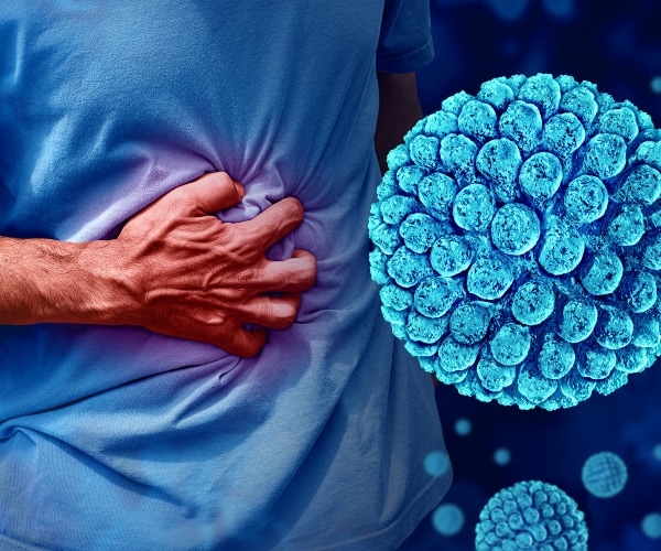 man holding stomach, virus particles in air