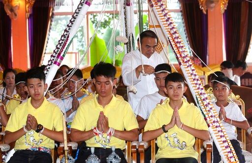 After Rescue, Thai Soccer Boys Pray for Fortune at Temple