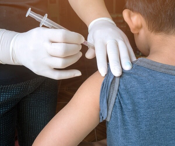 doctor giving vaccine