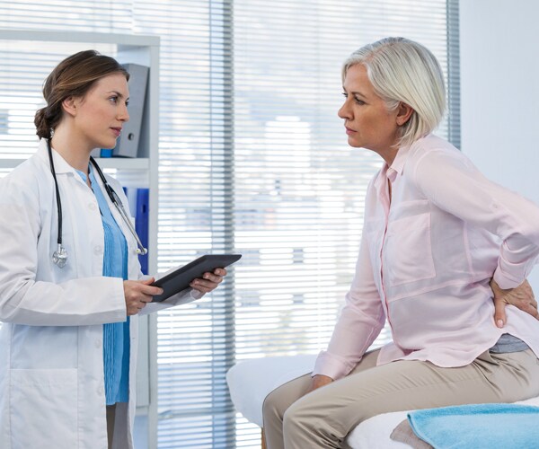 A patient talking with her doctor