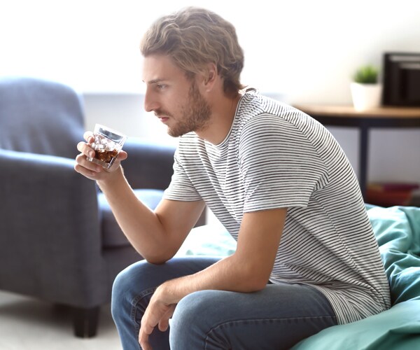 a man drinking at home