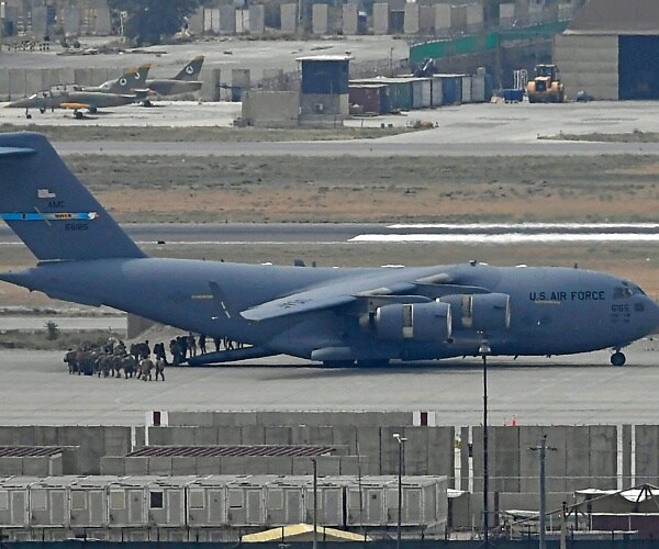 soldiers board plane