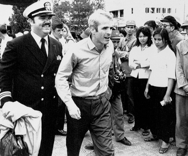 Flowers, Tributes Offered for McCain at Vietnam War Crash Site