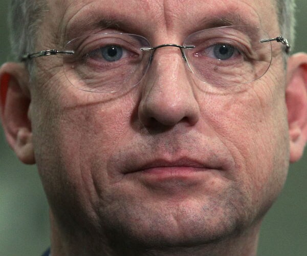 rep. doug collins listens to questions from members of the media