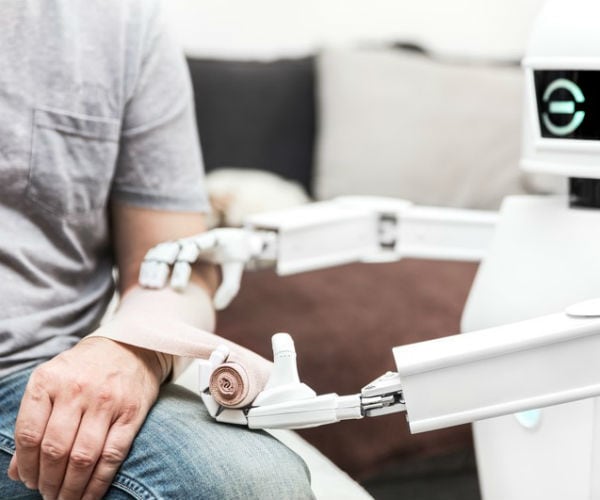 assistance medicine service robot puts a bandage on a arm of a male patient 