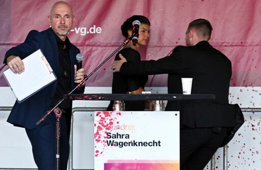 Prominent German Leftist Politician Sprayed with a Red Liquid, Likely Paint, During Campaign Event