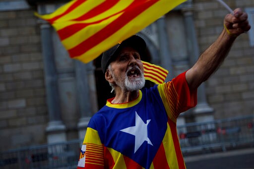 The Latest: Spain: Puigdemont Asylum Would be 'surprising'