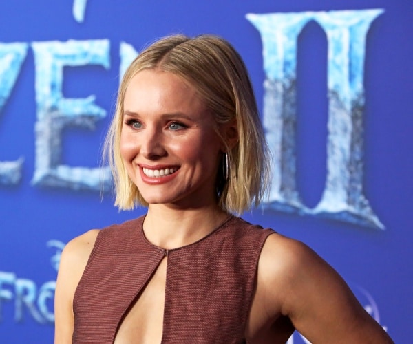 kristen bell in a pinkish-brown dress 