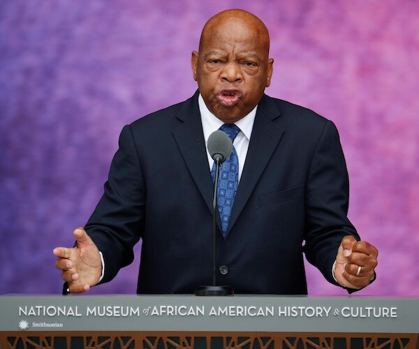 the late john lewis speaks during a convention