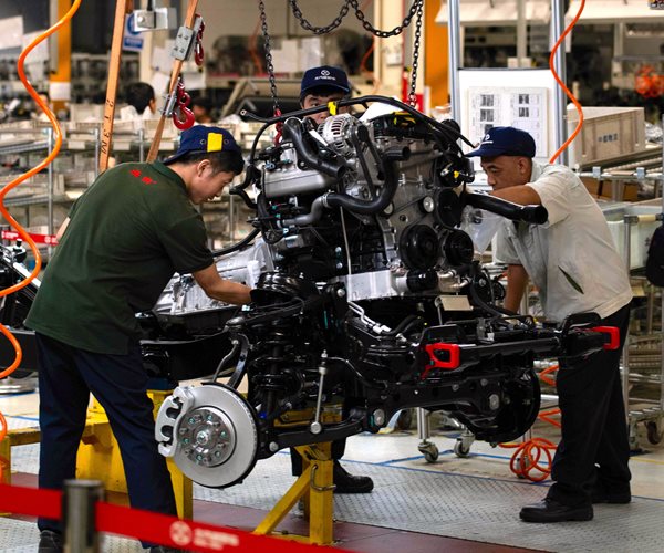 Factories Worldwide Squeezed by Escalating Trade Conflict