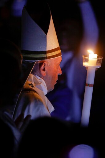 Pope Carries Easter Candle up Aisle of Darkened Basilica