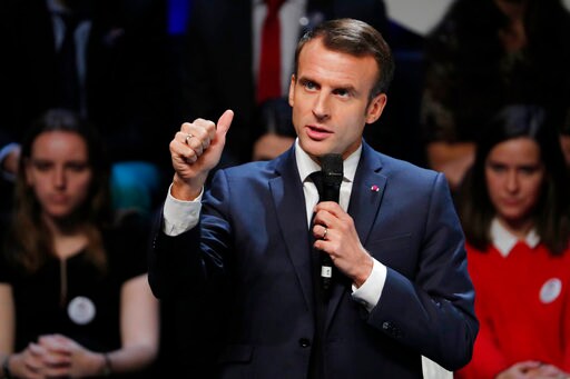 Macron Urges Dialogue amid Protests, Defends Gas Tax Hikes