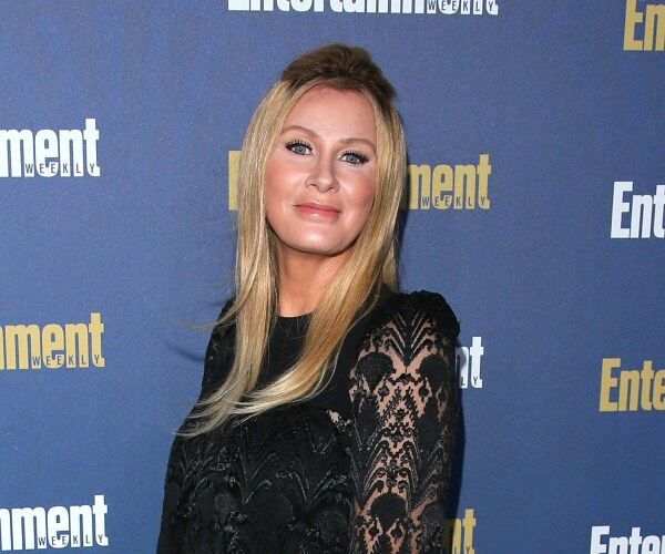 sandra lee poses for photo