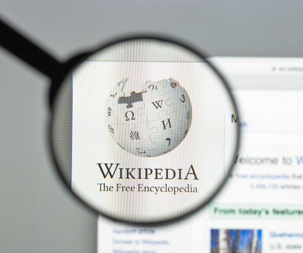wikipedia website under a magnifying glass