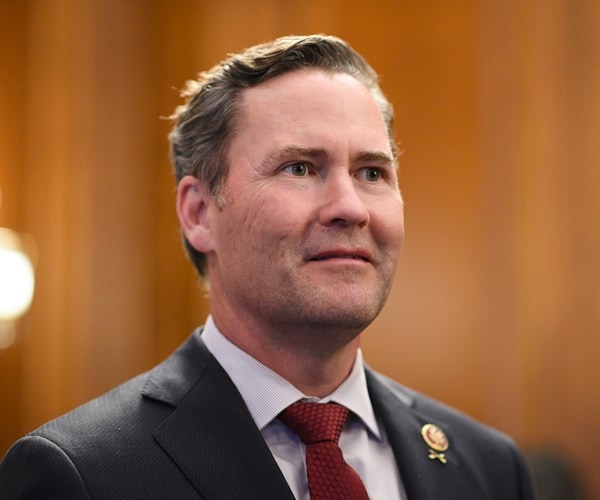 michael walks speaks at the capitol.