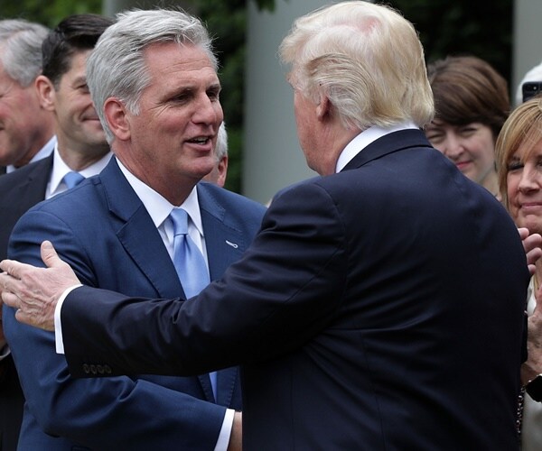 kevin mccarthy shakes donald trump's hand at an event on the white house rose garden.