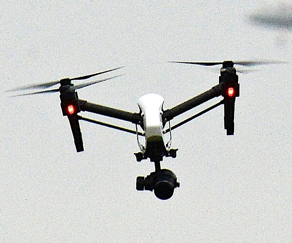 a drone is hovering in the air