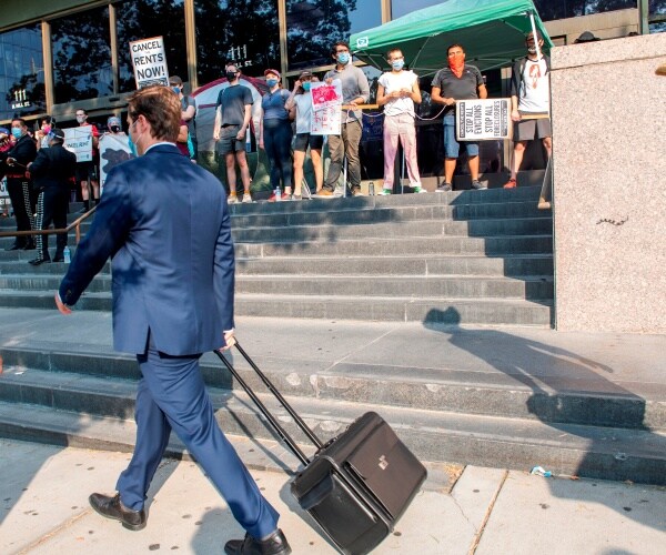 people protesting to cancel rent and avoid evictions